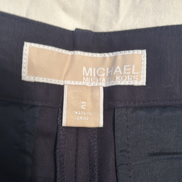 Two pairs of Michael Kors shorts size two.One solid black other navy and white - Picture 3 of 4